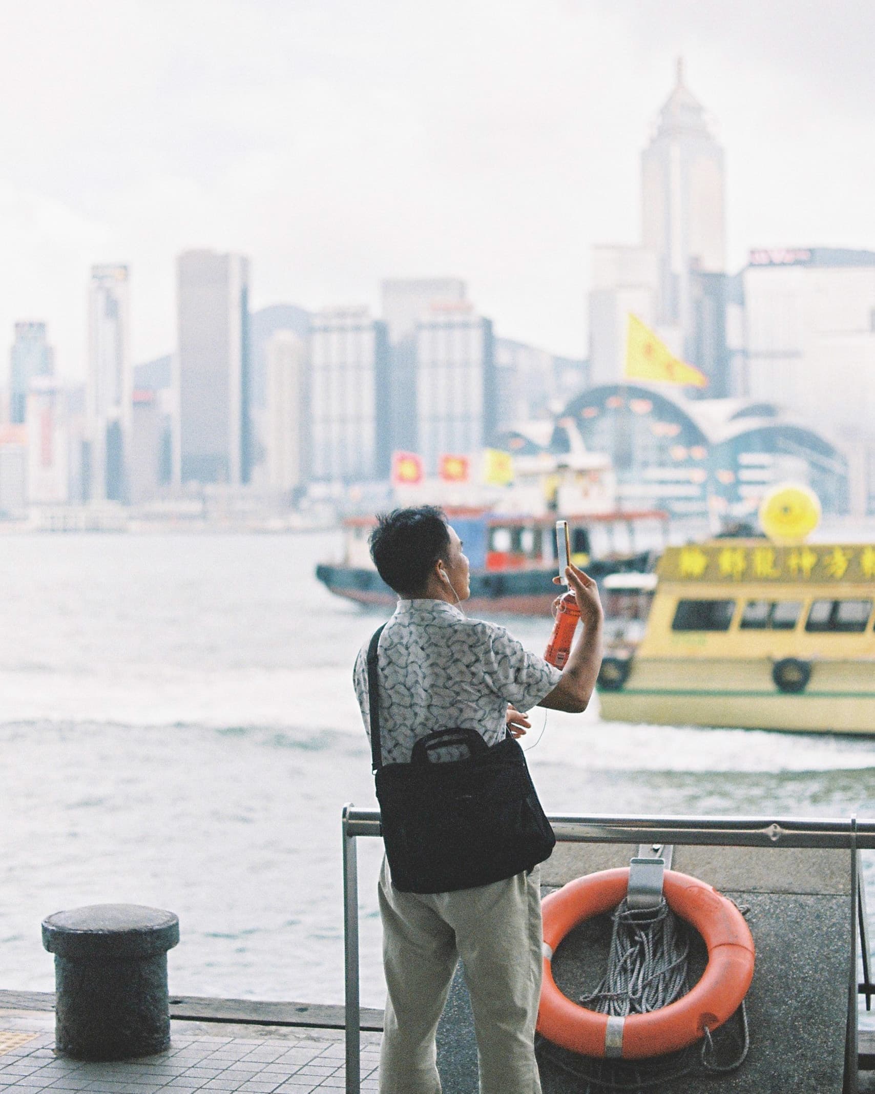 Hong Kong. Star Ferry. Man, video call. Hong Kong. Star Ferry. Man, video call.