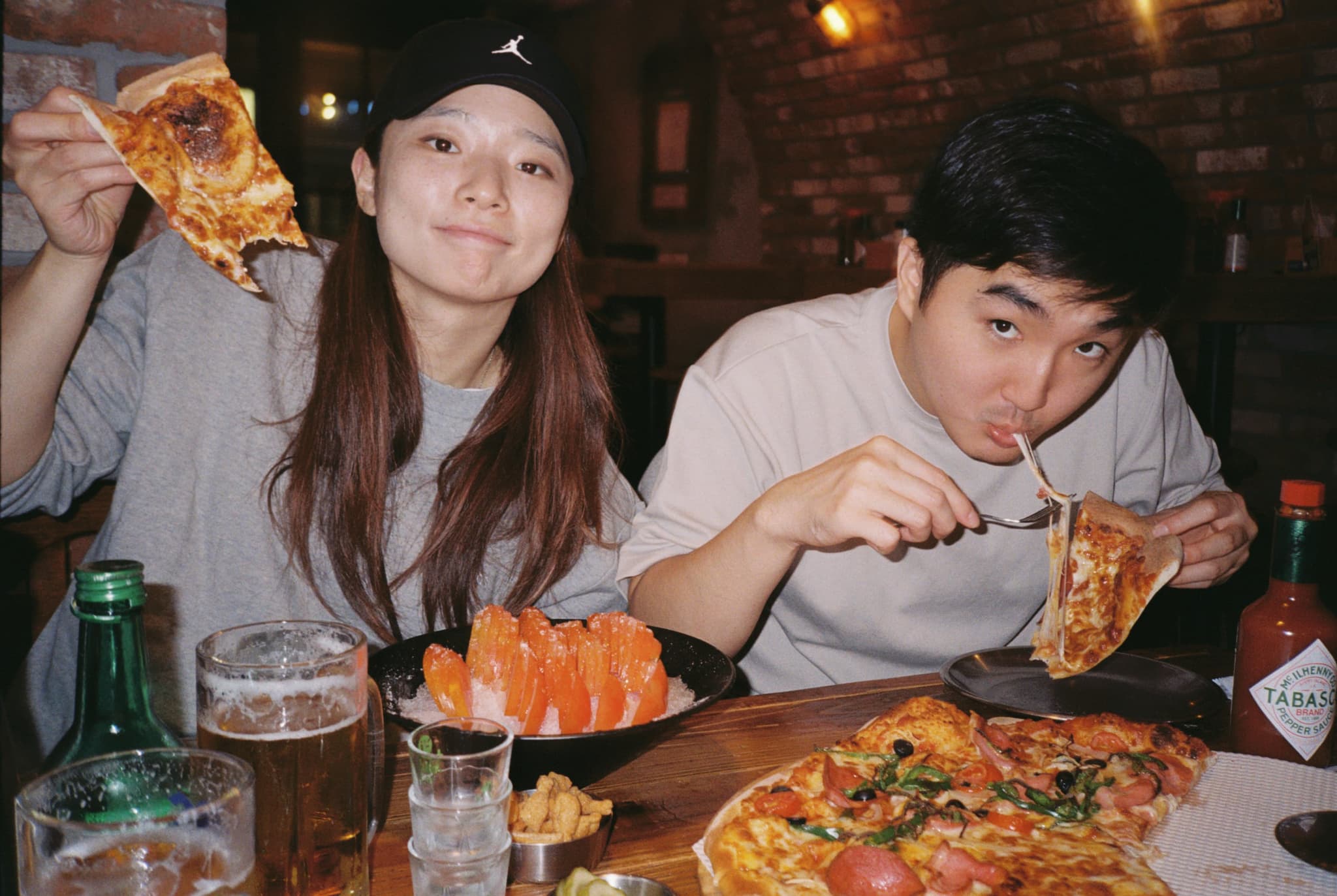 Sunny and Phil, eating pizza. Sunny and Phil, eating pizza.