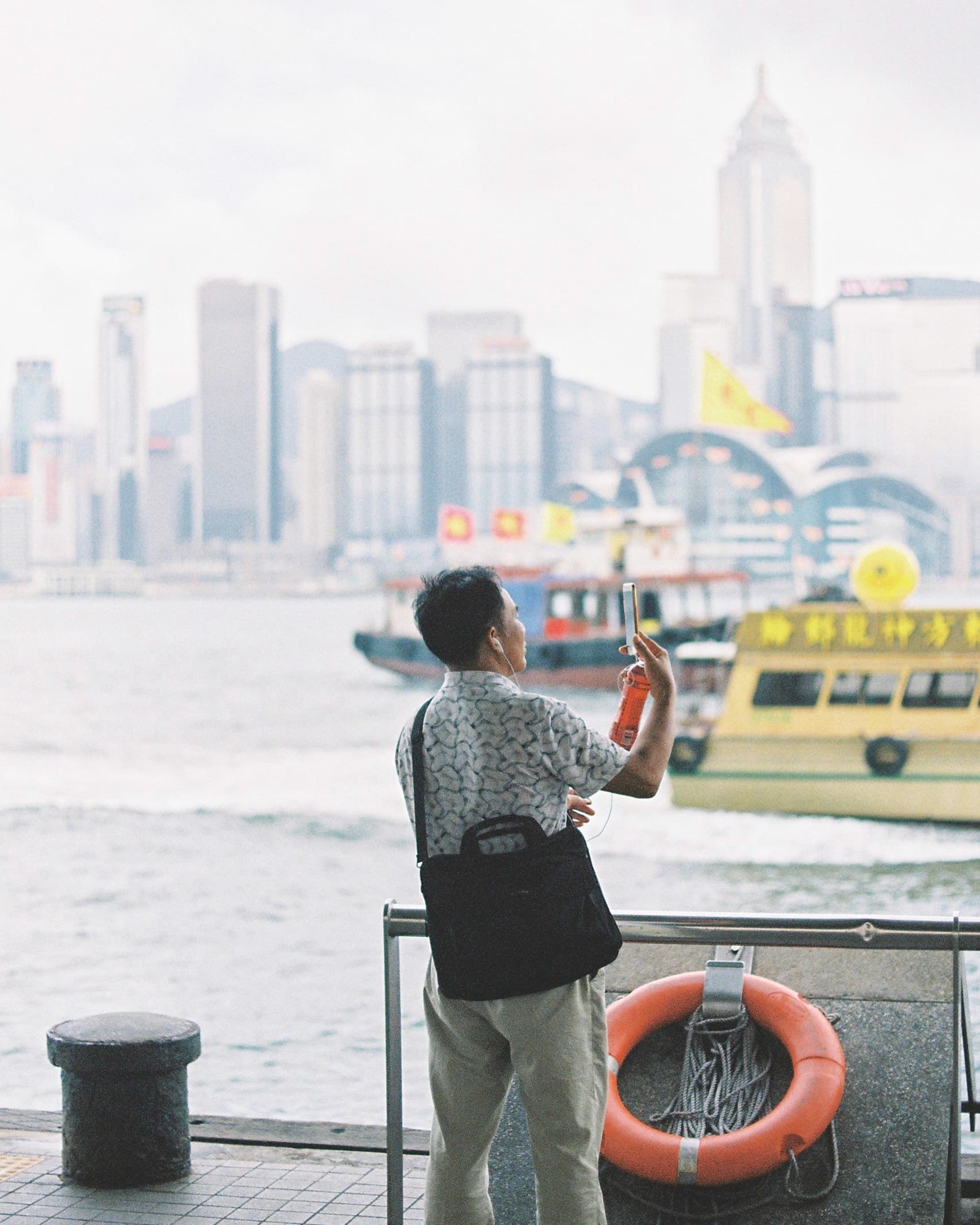 Hong Kong. Star Ferry. Man, video call.