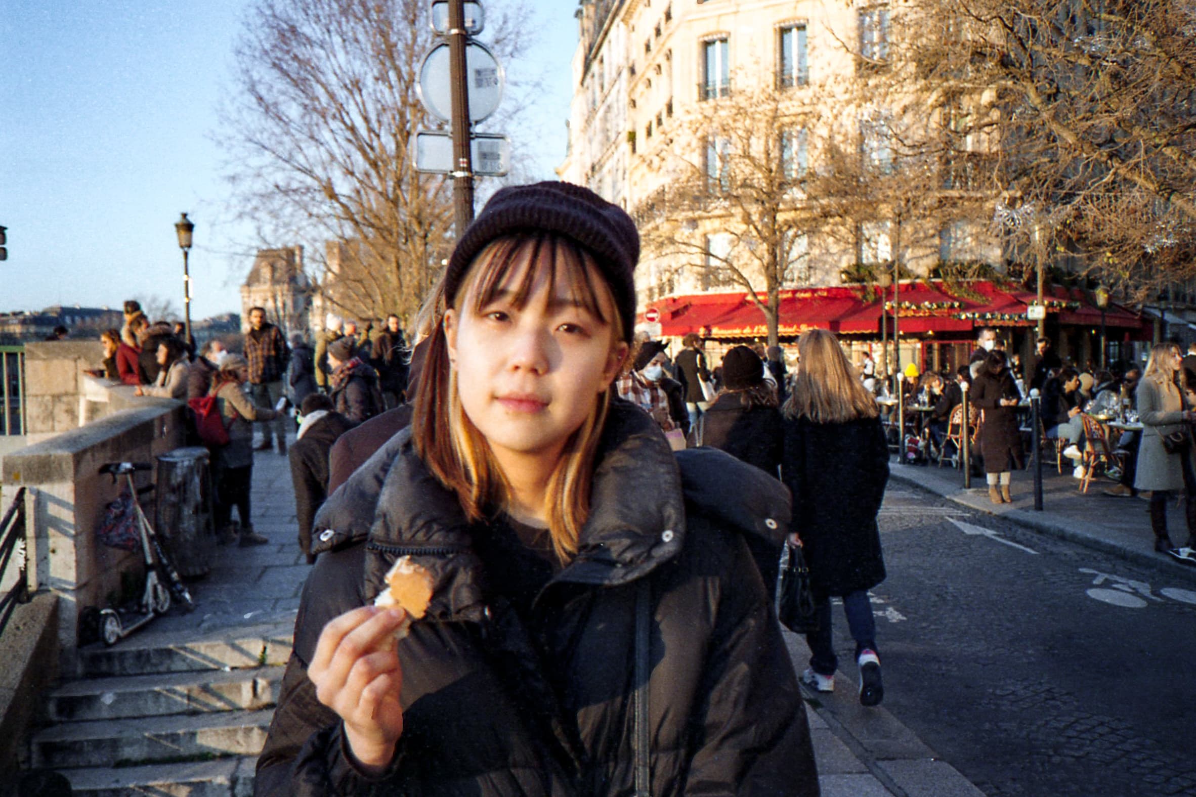 Paris, me eating baguette by the Seine.